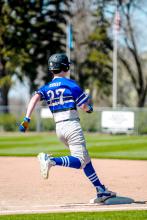 Ben Trudeau makes it safely to first base in the game against Scotland/Menno on April 21. Photo by Peterman Sports Photography stevepeterman5@gmail.com