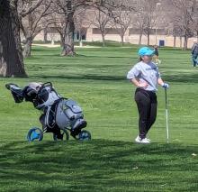 Natalie Wells waits her turn at the Two Rivers Golf Course in Dakota Dunes on April 22. Submitted photo