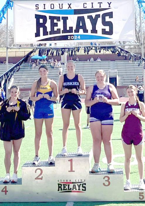 Grace Peed stands in the 1st place spot on the podium. She took 1st place in the discus with a throw of 129’1” at the SC Relays. Submitted photo