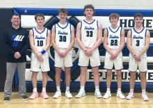The Husky seniors pose for a picture after their last regular game of the season against West Central. Pictured are, Head Coach Jake Otkin, Carson Timmins, Reed Sayler, Evan Fornia, Kayden Moore and Garrett Merkley. They each were able to score double digits in the contest. Submitted photo