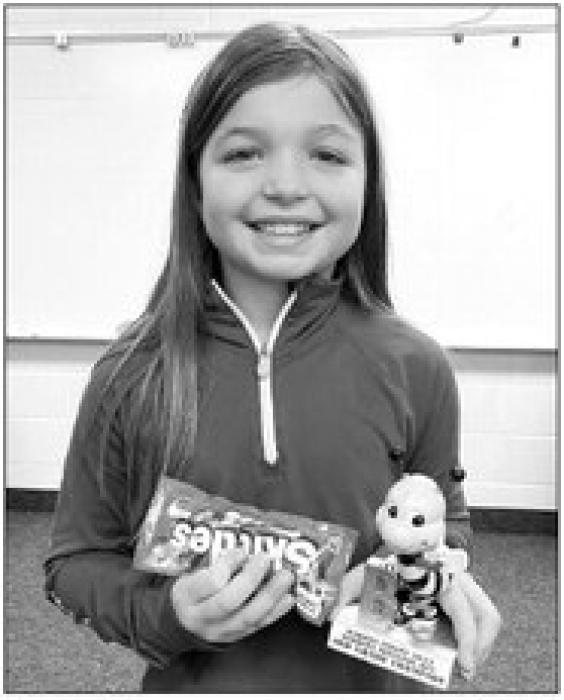 Dakota Valley 3rd grader Kate Richou won 1st place for the word “traditional”.
